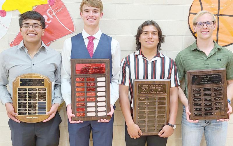 TOPS IN FOOTBALL—Perryton High School’s football team was honored on Monday evening at the Perryton High School All Sports Awards. Pictured are, from left: Junior Torres, who won the Best Football Lineman Award; Jacob Schollenbarger, winner of the Pete Peterson Award; Jahir Romero, Best Offensive Player; and Shep Miller, Best Defensive Player.
