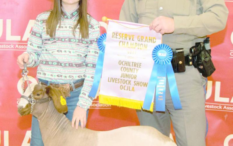 RESERVE GRAND CHAMPION GOAT— At the Ochiltree County Junior Livestock Show and Sale, Amelia Jumper took home the award for Reserve Grand Champion Goat. Her animal was purchased by Steven Jenkins. Pictured are, from left, Amelia Jumper and Steven Jenkins. (Photo credit: Tessa Powell)