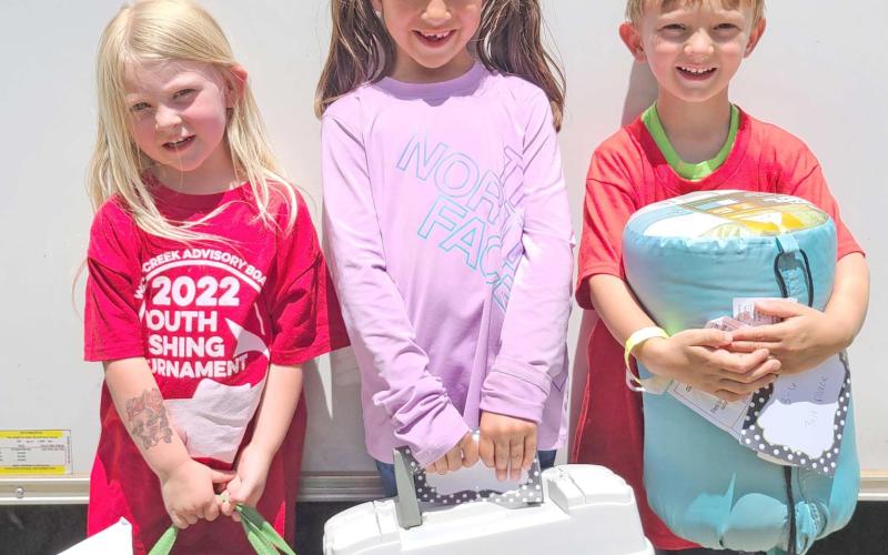 SMALL FRY, BIG FISH—Kids turned out in droves for Saturday’s Children’s Fishing Tournament at Lake Fryer and Wolf Creek Park. The top prize winners in the ages 3-6 category were, from left, Alice DeWitt (first place), Zoey Yara (second), and Camden Robinson (third).