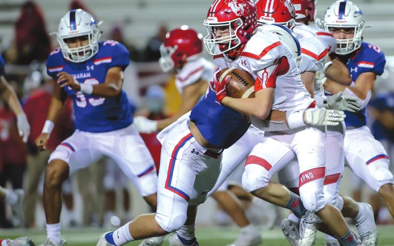 RANGERS END SEASON Junior Cuyler Feger takes a hit during a kickoff return late in the game versus the Graham Steers last Friday during the Area round of the playoffs. The Rangers fell to the Steers, 49-7 during the contest. See story for more information. (Photo by David Erickson)