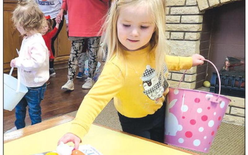 Perry Memorial Library’s last Story Time session of the year on Wednesday morning gave youngsters attending the program the chance to hunt for Easter eggs hidden around the library, in addition to listening to some stories and working on some arts and crafts projects. Yates Correll, age 3, came across a treasure trove of eggs in the library’s lobby.