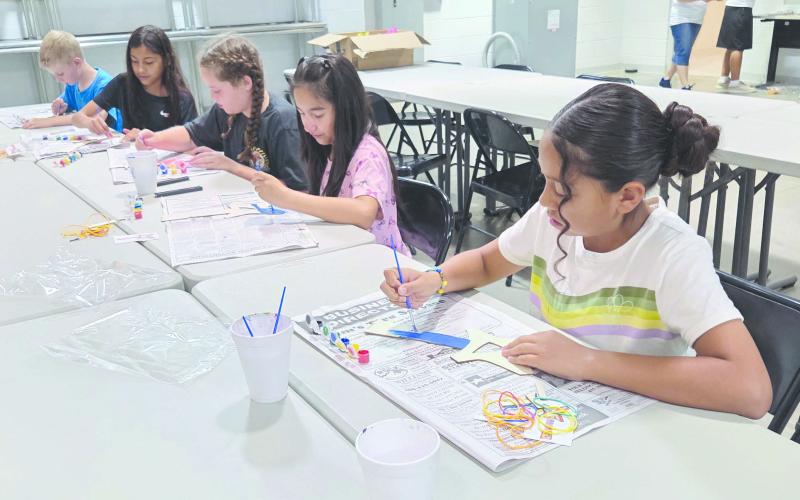 Frank Phillips College, Allen Campus, hosted the first session of their annual Kids College last week, with fun classes for kids 5-12 focusing on Hawaii. Kids enjoyed classes about arts and crafts, ocean life, science, music, painting, and more. Pictured are the kids in the 9-12 age group’s arts and crafts class decorating ukuleles.