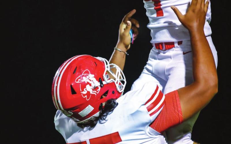 ROAD WIN – Edwin Osuna (75) lifts Pep Haley (4) after Haley secured a safety when Dalhart mishandled the snap on a punt. The Rangers secured the win in Dalhart on Friday, with 27 to 6. See related story for more information. (Photo courtesy of David Erickson)