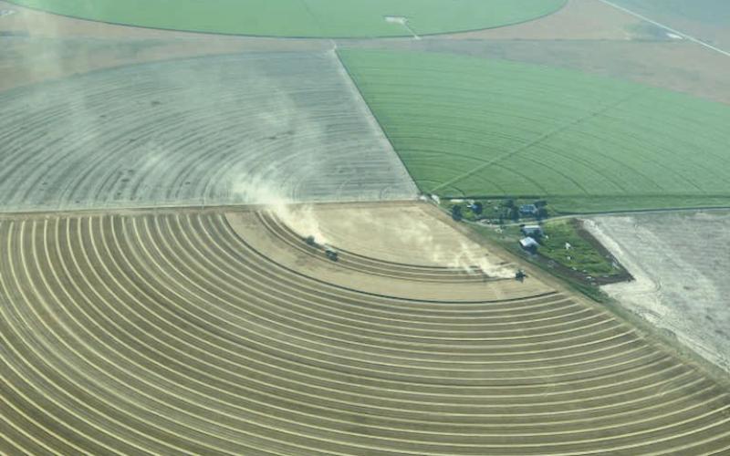 BIRD’S EYE VIEW OF HARVEST— This is an aerial view of harvest in action southwest of Farnsworth in early July, courtesy of Doug Hale.