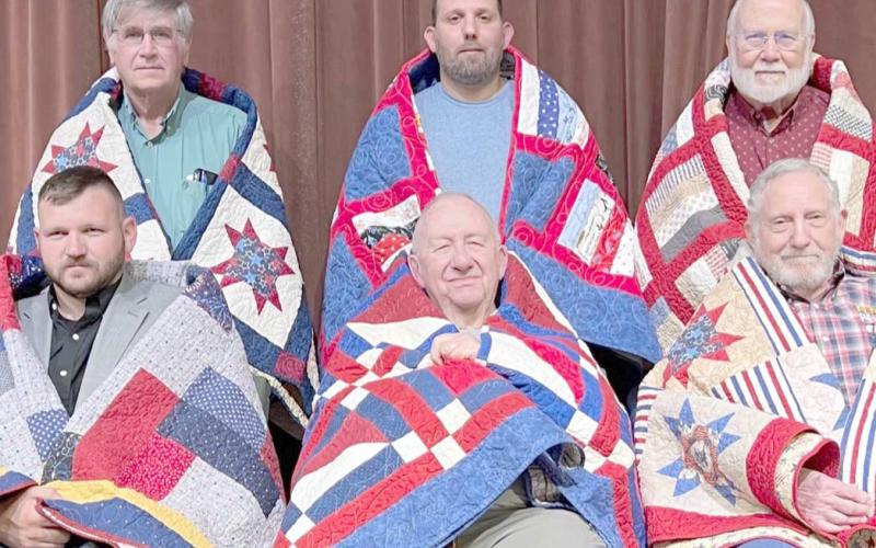 QUILTS OF HONOR RECIPIENTS— At a special presentation Oct. 12, 12 veterans received Quilts of Valor from the Friendship Quilt Guild. Recipients were, top photo, first row, All Sharpton, Paul Monk and Bob Hulsey; and second row, Braden Karber and Don Baker; and bottom photo, first row, Kevin Hardcastle, Jim Wilson and Byerl Bates; and second row, Ron Delk, Ryan Maddox and Dr. H.R. Sharp, Jr.