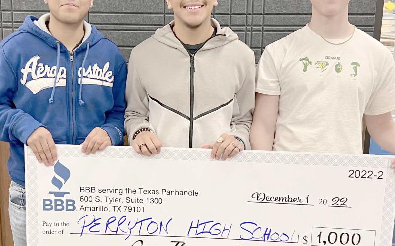 PHS STUDENTS WIN VIDEO CONTEST— Students in Perryton High School’s A/V Club submitted a video to the Better Business Bureau video contest in Amarillo, placing second and receiving a $1,000 check for new equipment for the club. The winning students were, from left, Sergio Campos, Edwin Ochoa, and Alex Jarrell. Not pictured is Samuel Perez.