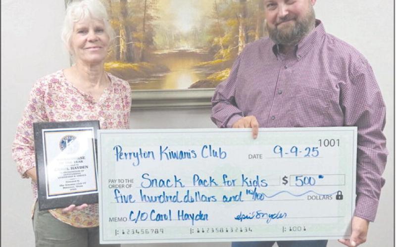 The Perryton Kiwanis Club named Carol Hayden as their Workhorse of the Year on Tuesday evening. She is a retired P.E. teacher at Wright Elementary and a founder of Snack Pak 4 Kids in Perryton. The Kiwanis Club also made a $500 donation to Snack Pak in honor of Hayden. Pictured are, from left, Hayden and Kiwanis president Chase Allison.