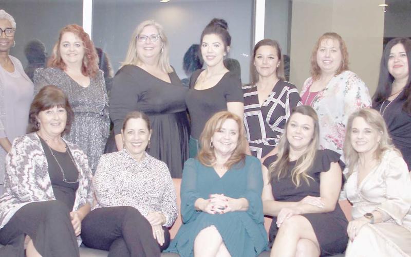 CHAPTER OF YEAR— Texas Municipal Clerks Association President Lee Woodward (standing back row, third from left) with City Secretary Kim Fowler (standing back row, third from right) pose with other Panhandle Chapter members at the TMC annual banquet in South Padre Island.The chapter was recognized as Chapter of the Year by the association.