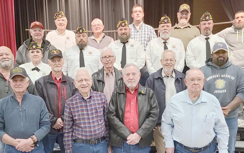 Area veterans were honored at Perryton High School’s annual Veterans Day program. Pictured are, from left, front row, are Doug McGarraugh, Senn Slemmons, Byerl Bates, and Robert Mantooth; second row, Ken Schwalk, Nikki Green, Duane McGarraugh, Bob Hulsey, Arvel Wall, and David Rogers; and third row, Mike Richardson, J.W. Brown, Chase Allison, J.W. Hardy, and Mike Skinner.