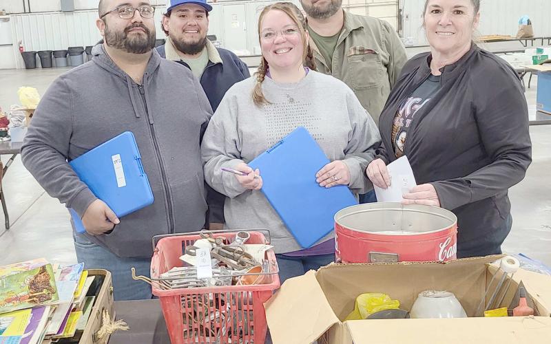 The Perryton Kiwanis Club held its 40th annual auction fund-raiser on Saturday, April 16, at the Ochiltree County Expo Center. This year’s auction included cars, pickups, trucks, trailers, boats, campers, motorcycles, workshop equipment, furniture, tool sets, welders, food baskets, gift certificates, and much more. Pictured organizing donations prior to the auction are, from left, front row, Ralph Gonzalez, Samantha Gonzalez, and Nikki Green; and back row, Daniel Chavira and Chase Allison.