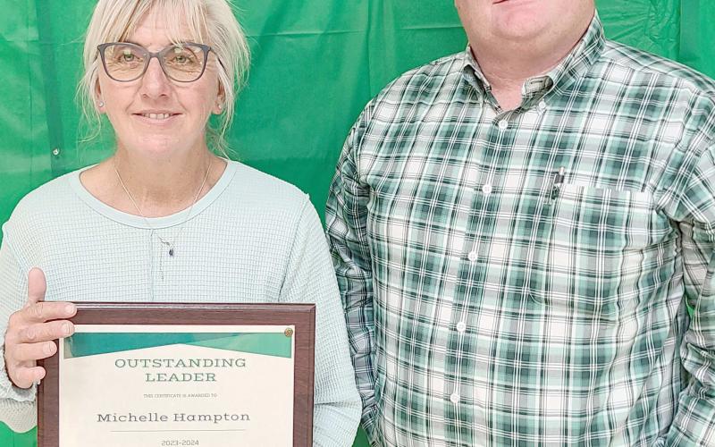 OUTSTANDING LEADER AWARD— Ochiltree County 4-H held their annual awards ceremony at the Ochiltree County Expo Center on Oct. 14. The award for Outstanding Leader went to Michelle Hampton for her leadership with the Horse Project. Pictured with her is 4-H Parents Association President Buddy Young.