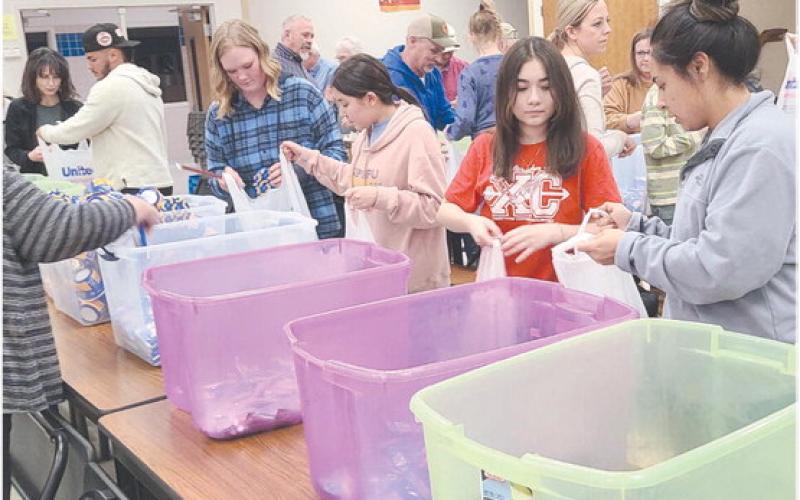 Local volunteers for Snack Pak 4 Kids gathered Monday evening at Williams Intermediate Elementary School to pack snacks for hungry kids. Volunteers meet every few weeks to pack snack bags with nutritious food to help food-insecure students stave off hunger. The Snack Pak 4 Kids program has been distributing over 100 packs every week to kids in Perryton.