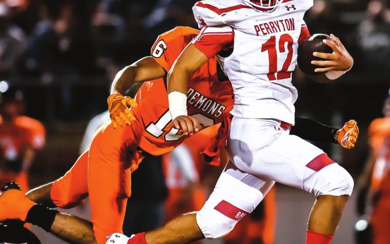 DUMAS BLANKS RANGERS Ranger Abraham Hernandez (Junior, #12) looks to break another tackle during a long scamper down the field early in the 4th quarter against the Dumas Demons. The team travelled to Dumas in their third game of the season. See story for more information. (Photo by David Erickson)