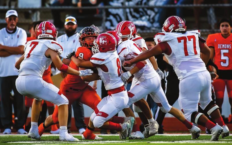 DOWN HE GOES – A swarm of Rangers, Shepherd Miller (#7, senior), Isaac Castro (junior, #8), Cuyler Feger (#5, junior) Alonzo Tarango (#77, junior) and Isaac Gabriel (#6, junior) brings down Demon QB Spencer Williams #9 in Dumas on Friday. The Rangers fell to Dumas, 30-0. See story on front page for more information. (Photo by David Erickson)
