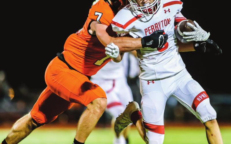 AWAY HE GOES – Junior Cuyler Feger tries to shake off a Demon Friday night, but is brought down for a short gain. The Rangers fell to Dumas, 30-0. (Photo by David Erickson)