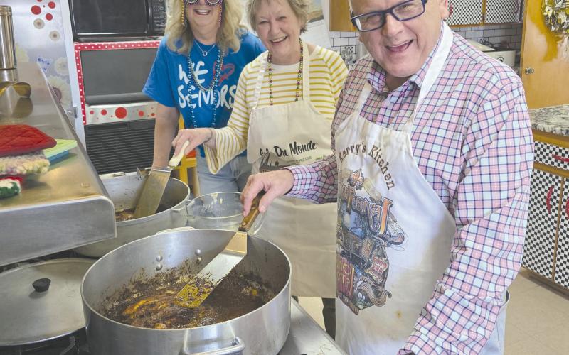 The Ochiltree County Senior Citizen Center had to postpone their Mardi Gras celebration for a week, but the whole crew got together Tuesday evening to enjoy a Cajun meal of blackened catfish, blackened chicken, dirty rice, spinach madeline, shrimp remoulade, and bread pudding. Pictured are, from left, Senior Center director Daryla Allred and guest chefs Cynthia and Kerry Symons.