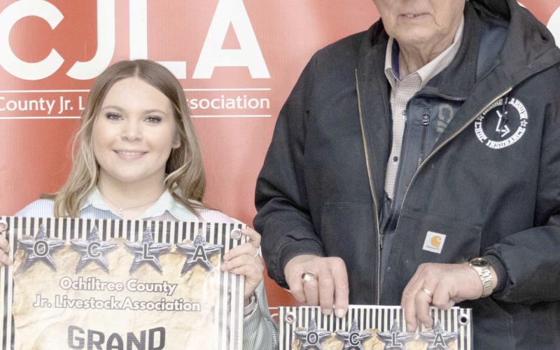 At the Ochiltree County Junior Livestock Show and Sale on Jan. 1617, Avery Swenhaugen took home the award for Grand Champion Swine. Her animal was purchased by Broken Arrow Crop Insurance. Pictured are, from left, Avery Swenhaugen and Larry Schickedanz. ( Photo Credit: Hailey Clark of Hailey Renee Photography)