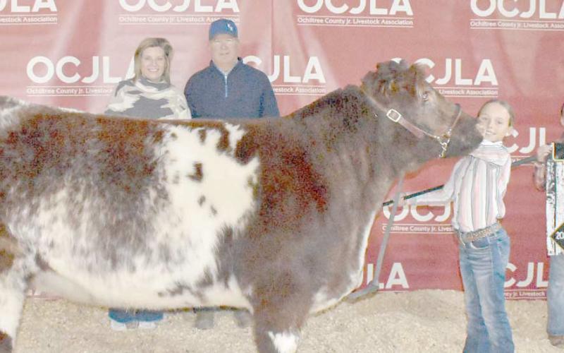 At the Ochiltree County Junior Livestock Show and Sale on Jan. 17-18, Gabby Heck took home the award for Grand Champion Heifer. Her animal was purchased by Steven and Paige Waide. Pictured are, from left, Paige Waide, Steven Waide, Gabby Heck, and Izzy Heck. ( Photo credit: Morgan Dudley)