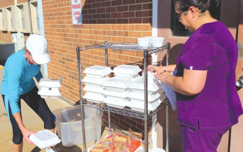 VOLUNTEERS HELPING NEIGHBORS