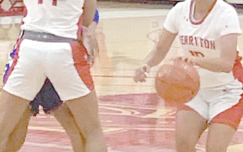 RETTE BASKETBALL—The Rangerettes hosted the Canyon Lady Eagles Tuesday in their second district game. The Lady Eagles dominated the contest, winning 73-33. Above, point guard Tonya Navarrete (10) dribbles by a pick set by Analia Loera (14) on her way to the bucket.