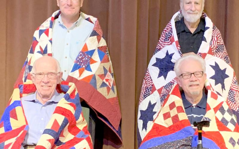 QUILTS OF VALOR—The Friendship Quilt Guild presented 19 Quilts of Valor Sept. 9. The quilts are given to local area veterans to honor their service to America. Nine of those recipients are, top photo, first row, Price Money and L.G. Halliburton; and second row, Eileen Broadbent, Rodney Cates and O.B. Callahan. In the bottom photo are, first row, Tark Cook and Don Simpson; and second row, Curtis Parker and Danny Barclay. Each of the quilts are handmade and quilted by members of the Friendship Quilt Guild.