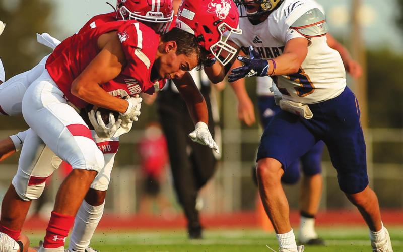 RANGERS SEASON OPENER – Isaac Gabriel #6 (junior) loses a helmet during a punt return early in the first quarter of play in the Rangers home opener against the Golden Wolves of Dalhart. (Photo by David Erickson)
