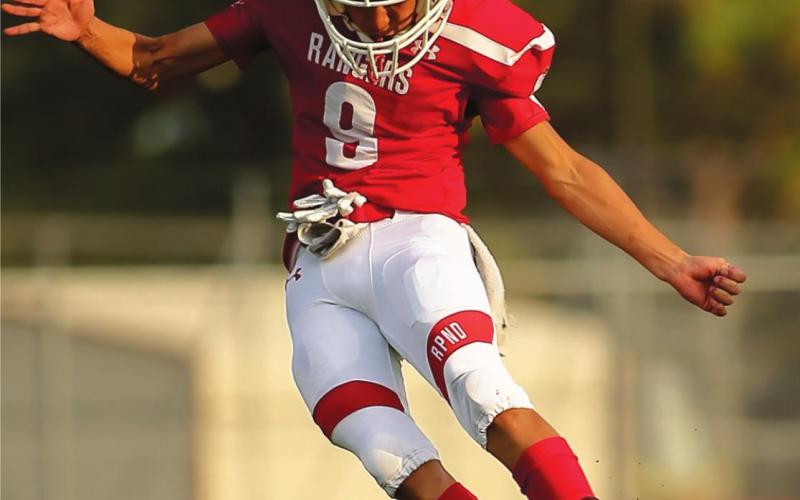 2020 OPENER – Tony Cervantes #9, (junior, at right) kicks the dust off for the highly anticipated and unique 2020 football season for the Perryton Rangers. The Rangers faced the Dalhart Golden Wolves in a contest at Ranger Field that was cut short due to a power outage at the stadium, just before the opening of the second half. (Photo by David Erickson)