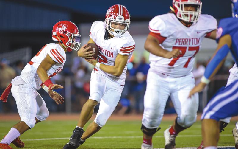 RANGERS FALL TO BOBCATS Perryton Ranger Stetson Garcia (middle) takes the handoff and looks for a seam during the 3rd quarter against the Childress Bobcats, who took the win with a score of 29-7. Next up, the Rangers will host Caprock for Homecoming. Game time is 7:00 P.M. See story for more information. (Photo courtesy of David Erickson)