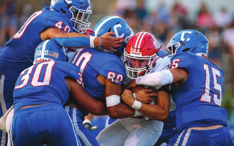 BLOCKED– Ranger Julian Cervantes, #14 meets a wall of Bobcats as the Rangers tried to rally in the second quarter against Childress, who ultimately won the game 29-7. See story for more information. (Photo courtesy of David Erickson)