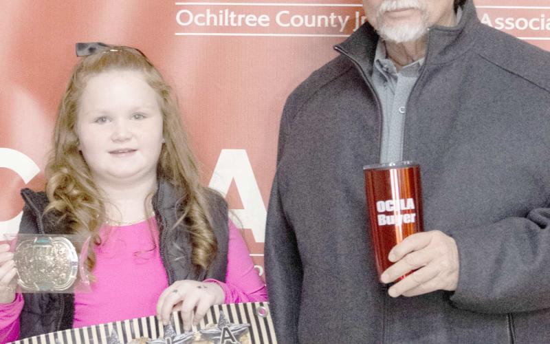 The award for Grand Champion Goat at the Ochiltree County Junior Livestock Show and Sale on Jan. 16-17 went to Bryar Herod. The animal was purchased by Lone Star Ag. Pictured from left are Bryar Herod and Keith Come. ( Photo credit: Hailey Clark of Hailey Renee Photography)