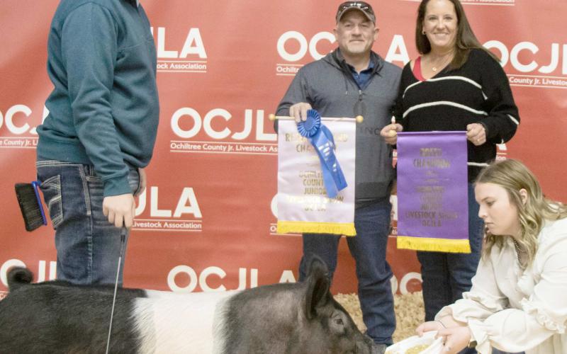 RESERVE GRAND CHAMPION SWINE— The award for Reserve Grand Champion Swine at the Ochiltree County Junior Livestock Show and Sale went to Landry Anderson. The animal was purchased by Hansford County Vet and Hansford County Vet Supply. Pictured from left are Landry Anderson, Tod and Kris Keeth, and Raylee Murry. ( Photo credit: Tessa Powell)