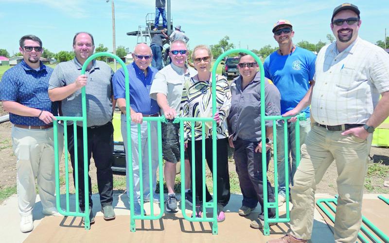 NEW PLAYGROUND UNDER CONSTRUCTION— The City of Perryton is in the midst of installing a new playground at Murphy Park, with a goal of having the site completed by next week. City staff, members of the Parks Advisory Board, and members of the Perryton City Council turned out Tuesday afternoon to check out the playground site. Pictured are, from left, Brady Burdick, J Aston, Kerry Symons, Brad Herring, Mary Dudley, Lynette Fossand, Brad Kile and Brandan Knapp.