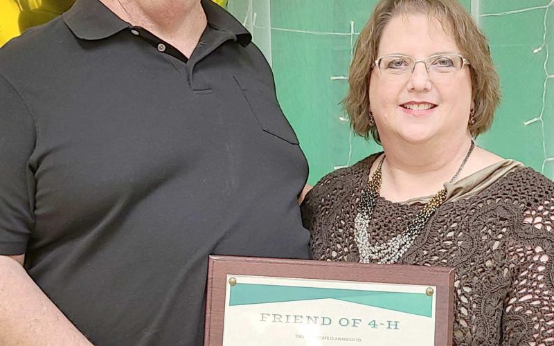 FRIENDS OF 4-H— During the annual awards ceremony for Ochiltree County 4-H at the Expo Center on Monday night, awards were presented for Friends of 4-H for individuals and businesses that go above and beyond to support 4-H programs with donations of time and material resources. Award winners included, from left, Sid and Stacey Tanner. Not pictured is Perryton Herald reporter Scott Slemmons.
