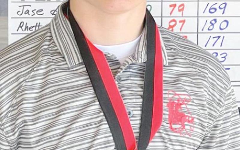 TOP MEDALIST—Ranger Hunter Milsap displays his first place medalist award he earned at the Borger Invitational.