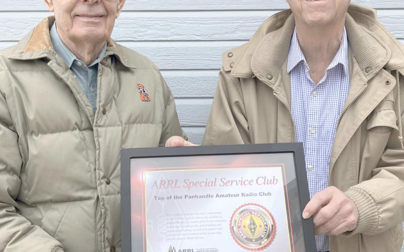 TOPARC MEMBERS RECOGNIZE CLUB FOUNDERS— Members of the Top of the Panhandle Amateur Radio Club (TOPARC) met recently to celebrate the club’s 50th anniversary. Hugh Barton, at left, and Jerome Doerrie were recognized as the founders of the organization.