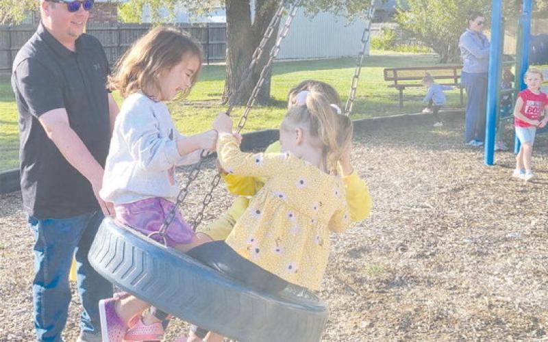 SWINGING IN THE TIRE SWING