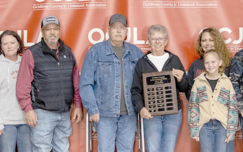 STOCK SHOW DEDICATED TO SPLAN— This year’s Ochiltree County Junior Livestock Show and Sale was dedicated to Ruth Ann Splan. Pictured are, from left, Garrett McMillian, Caileigh Johnston, Kristen Lane, Joe Lane, Dennis Splan, Ruth Ann Splan, Jennifer Stickney, Bryer McMullen (in front), Jackson McMullen, and Jace Marshall. ( Photo credit: Hailey Clark of Hailey Renee Photography)