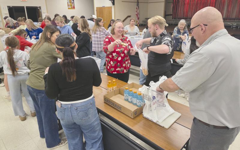 Local volunteers for Snack Pak 4 Kids gathered Monday evening at Williams Intermediate Elementary School to pack snacks for hungry kids. Volunteers meet every few weeks to pack snack bags with nutritious food to help food-insecure students stave off hunger. Volunteers include students from Perryton High School, local business employees, church groups, and people who just want to help.
