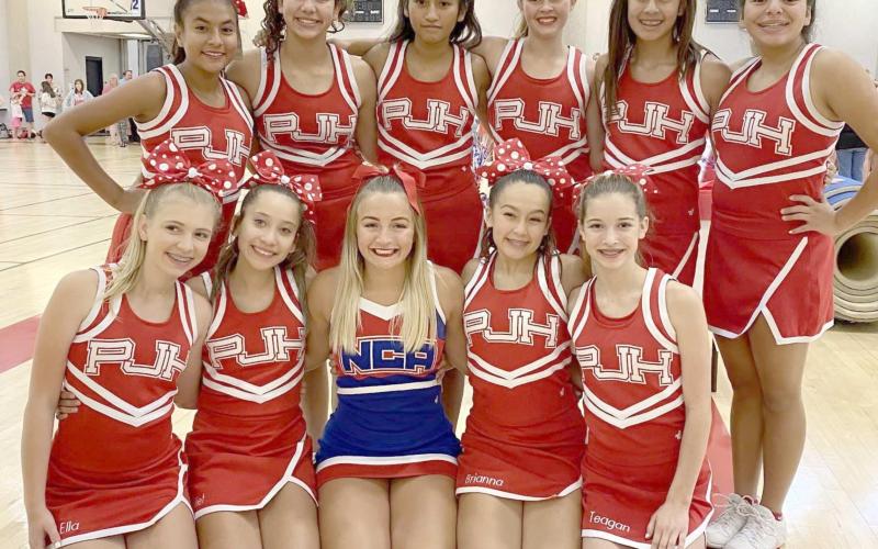 PJH CHEERLEADERS—The Perryton Junior High Cheer Squad recently attended NCA camp at OU in Norman. Squad members are, first row, from left, Ella Brady, Juliet Mier, NCA Cheer Buddy Presley, Brianna Galvez and Teagan Duke; and second row, Geraldine Gamez, Kaleigh Potts, Mily Bernal, Tana Williams, Natalie Hernandez and Nevaeh Martinez.