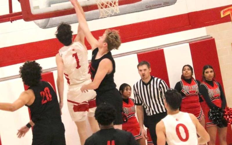 RANGERS FACE BORGER – Daxton Rigdon, #1, drives to the bucket and scores during Tuesdays game against the Borger Bulldogs. See story for more information.