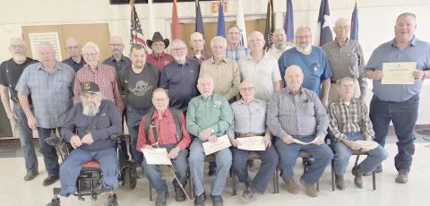 DAR HONORS VIETNAM VETS—The Wolf Creek Chapter of the National Society Daughters of the American Revolution commemorated National Vietnam War Veterans Day on March 29 by recognizing and honoring local veterans of the Vietnam War during their regular meeting in March. Pictured are, from left, front row: Danny Cash, Neal Davis, Byerl Bates, Stan Luck, Bobby Kile, and Dale Herring; second row: Randy Redmon, Senn Slemmons, Richard Cornelius, Keith Whitely, Doug McGarraugh, Merle Davis, and Freddy Bohannon; 