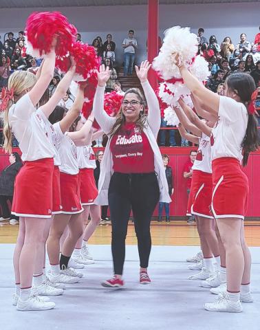 A TRIBUTE TO TEACHERS AND STUDENTS Perryton Junior High held a pep rally Monday to celebrate the school’s improved academic status, as it earned an official “Acceptable” rating from the Texas Education Agency. Teachers and students at PJH were congratulated by PISD administration staff, school board members, and representatives from TEA and the Region 16 Service Center. Pictured running through the PJH cheerleaders’ pom-pom tunnel is English teacher Maribel Murillo.