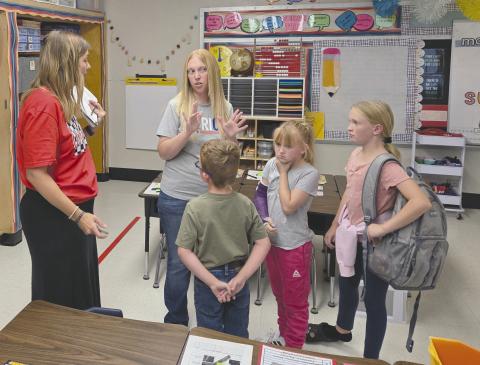 As Perryton Independent School District welcomed students back for another year at school on Wednesday, teachers and staff used the first half of the week to make final preparations for the year and to hold “Meet the Teacher” events to students and parents could get to know their new teachers one-on-one. Pictured at the Meet the Teacher event at Wright Elementary on Monday are, from left, first grade teacher Marci Kirklin, Melissa Meyer, Marshall Meyer, age 6, Madison Meyer, 9, and McKenzie Meyer, 11.