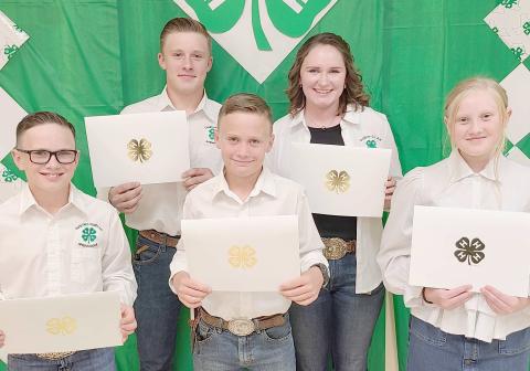 150 POINT AWARDS— Ochiltree County 4-H held their annual awards ceremony Monday night at the Expo Center. Members who accumulated 150 points or more received a certificate and the Donnie Pshigoda Points Scholarship, a $75 scholarship, sponsored by the Ochiltree County Soil and Water Conservation District in honor of Donnie Pshigoda. Pictured are, from left, front row, Clay Oquin, Brady Oquin, and Hannah Young; and back row, Kyle Oquin and Rylan Oquin.
