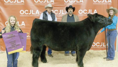 GRAND CHAMPION STEER— This year’s Grand Champion Steer at the Ochiltree County Junior Livestock Show and Sale on Jan. 20-21 was awarded to Maddie Schickedanz. The animal was purchased by Broken Arrow Crop Insurance, John Floyd Earth Moving, and Chris Smith Wealth Management. Pictured are, from left, Sydney Schickedanz, Larry Schickedanz, Jason Schickedanz, and Maddie Schickedanz. (Photo credit: Brittany Morgan)