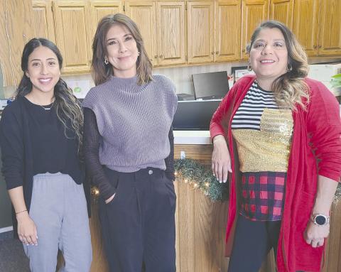 GARLANDS OF GIVING The City of Perryton has once again set up a Giving Garland this year instead of the traditional Giving Tree in City Hall to assist local citizens who have difficulty paying their winter heating bills. Anyone can make anonymous donations to help pay utility bills. Pictured with the garland are, from left, city employees Sandra Sosa, Laura Rivera, and Patty Martinez.