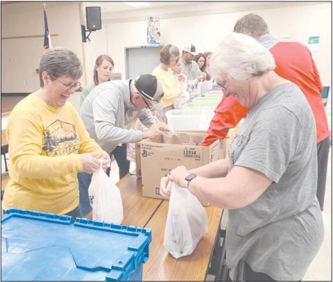 VOLUNTEERS COMING TOGETHER