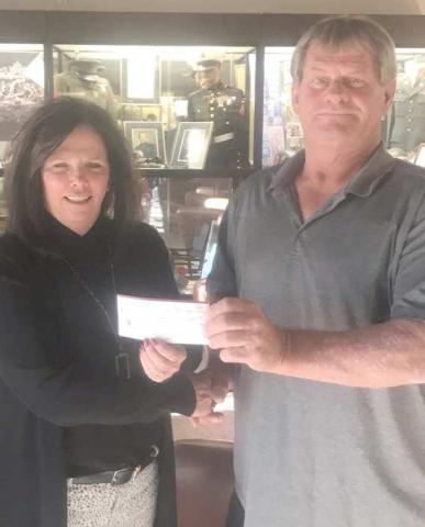 Perryton Elks Lodge 2368 donated $4,000 to the VA Hospital in Amarillo to help with supplies for residents of the facility. The donation was made possible through one of the grant programs available to Elks Lodges across the country. Pictured are VA representative Trisha Reid, left, and Elks Exalted Ruler Dewayne Holdeman.