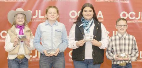 JUNIOR CHAMPION SHOWMANSHIP WINNERS—At the Ochiltree County Junior Livestock Show and Sale, the Junior Champion Showmanship Awards were presented to participating students. Pictured are, from left: Sydney Schickedanz, Addilynn Reihm, Saraelee Pshigoda, and Clay Oquin. (Photo credit: Tessa Powell)