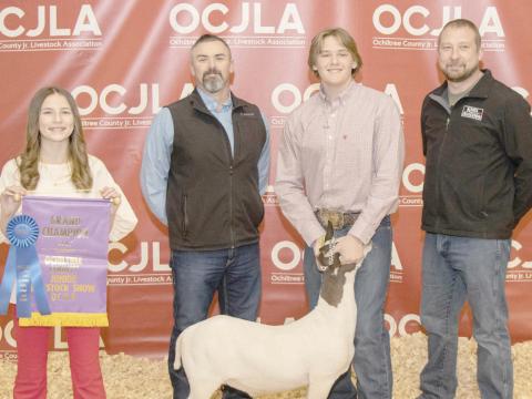 GRAND CHAMPION GOAT—The award for Grand Champion Goat at the Ochiltree County Junior Livestock Show and Sale on Jan. 19-20 went to Cash Wheeler. The animal was purchased by Frontier Accessories and Knox Aviation. Pictured from left are Davanee Anderson, Brandt Oquin, Cash Wheeler, and Bear Knox. (Photo credit: Tessa Powell)